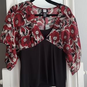 Red, black flowered blouse